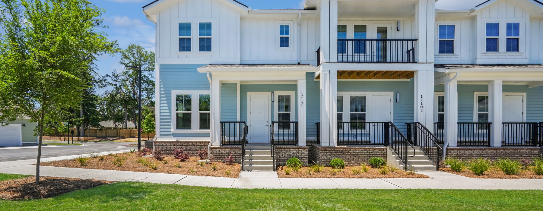 Townhome with a large front lawn